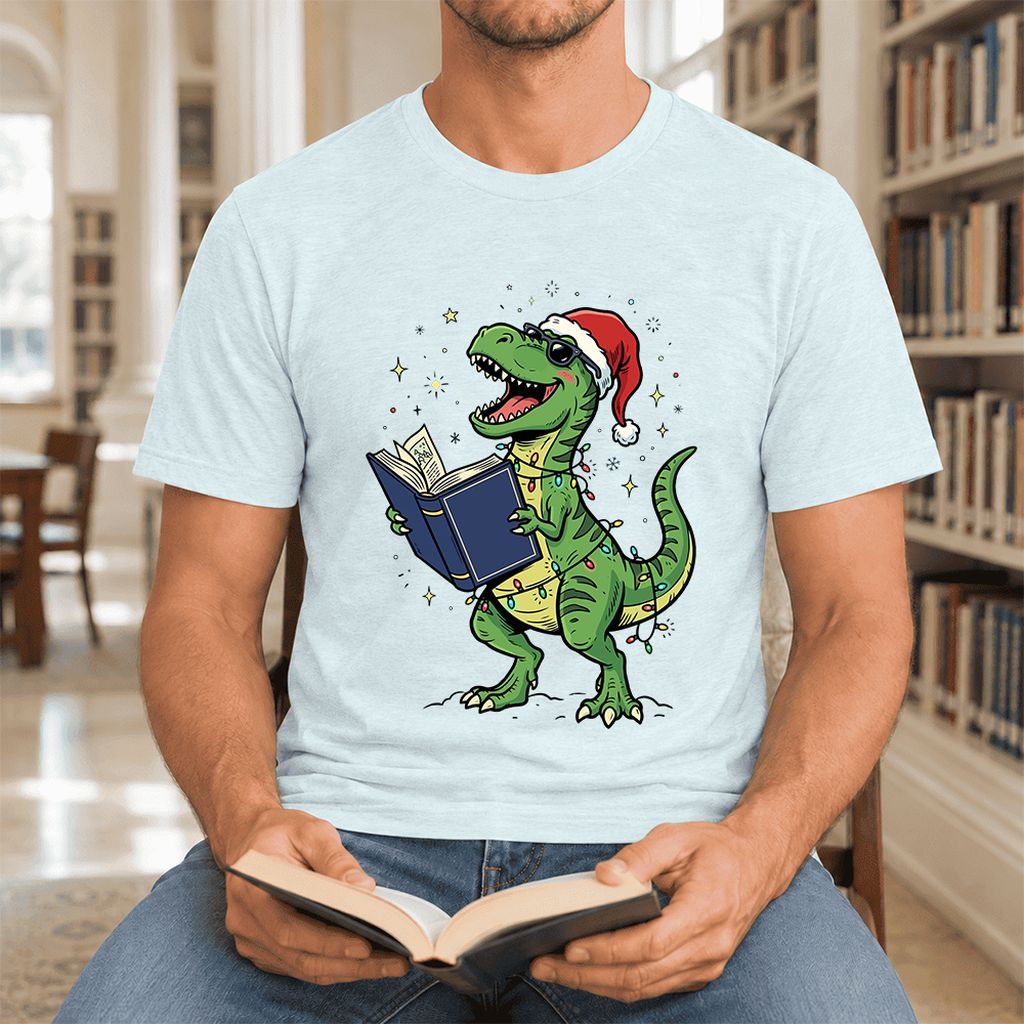 T-Rex Wearing Santa Hat And Reading Ultra-Soft Cotton T-Shirt | Christmas Gift Heather Ice Blue