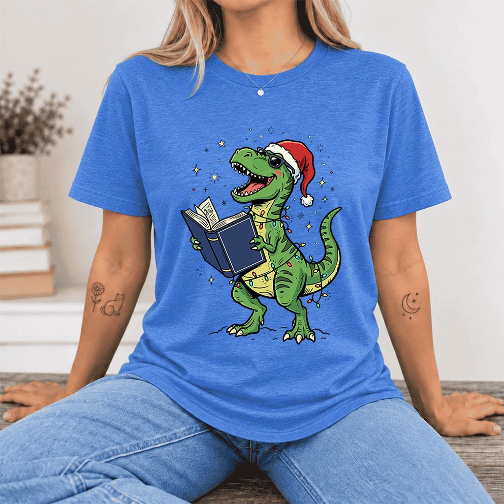 T-Rex Wearing Santa Hat And Reading Ultra-Soft Cotton T-Shirt | Christmas Gift Heather True Royal