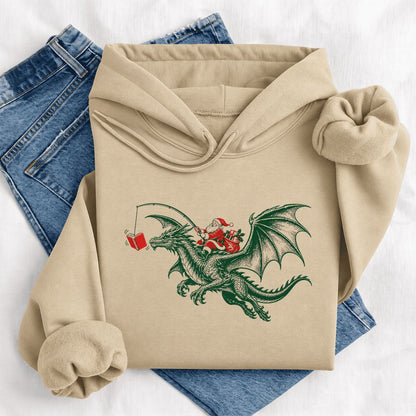 Santa Riding Green Dragon Softstyle Hoodie | Christmas Fantasy Reader Gift Sand