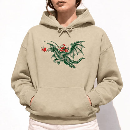 Santa Riding Green Dragon Softstyle Hoodie | Christmas Fantasy Reader Gift Sand