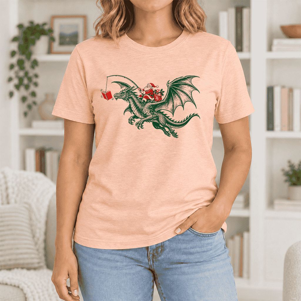Santa Riding Green Dragon Ultra-Soft Cotton T-Shirt | Fantasy Reader Gift Heather Peach