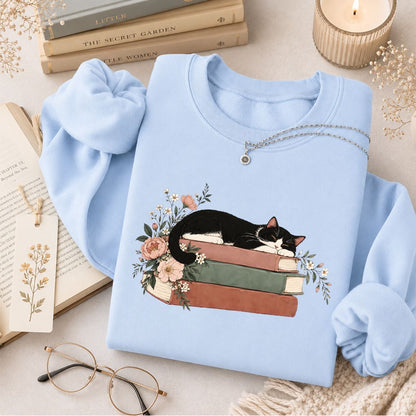 Sleeping Tuxedo Cat On Books Crewneck Sweatshirt | Cat Lover Reader Gift Light Blue