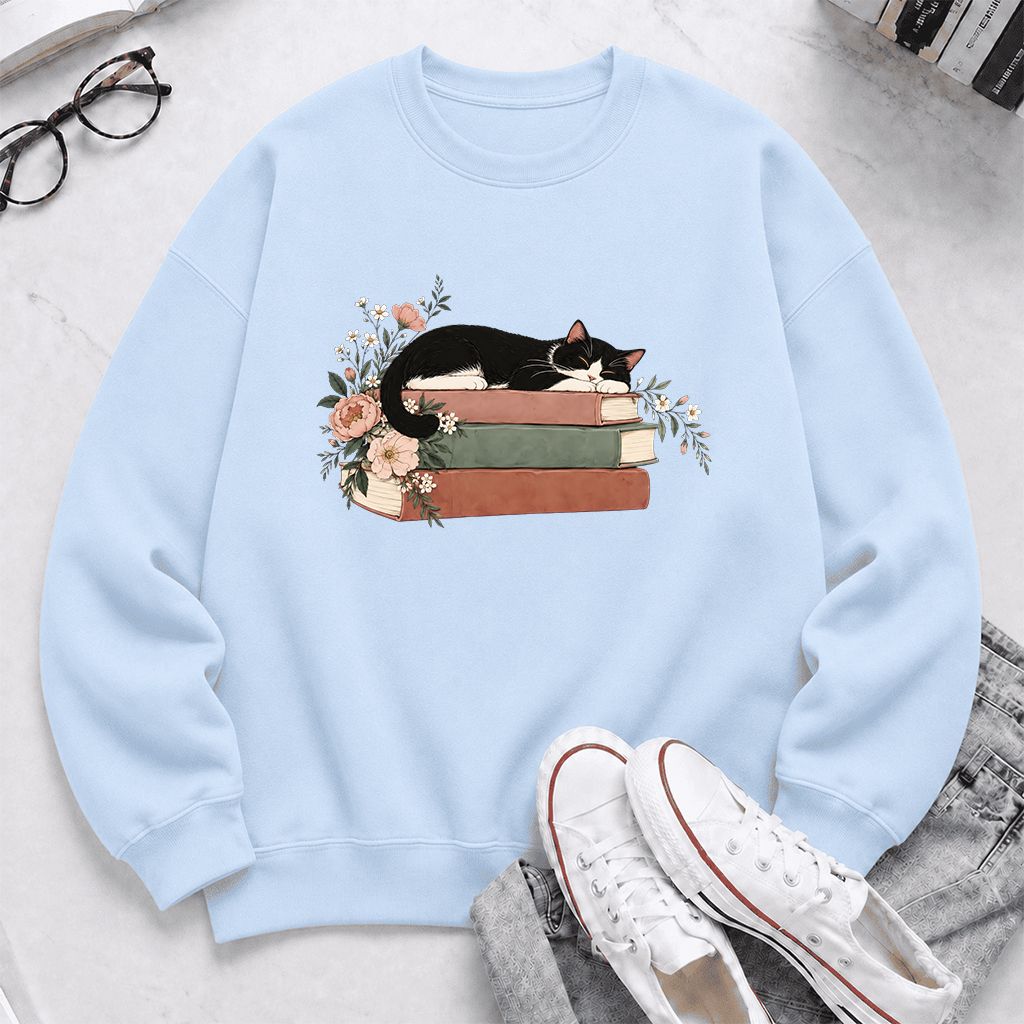Sleeping Tuxedo Cat On Books Crewneck Sweatshirt | Cat Lover Reader Gift Light Blue