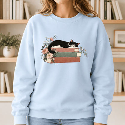Sleeping Tuxedo Cat On Books Crewneck Sweatshirt | Cat Lover Reader Gift Light Blue