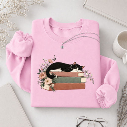 Sleeping Tuxedo Cat On Books Crewneck Sweatshirt | Cat Lover Reader Gift Light Pink