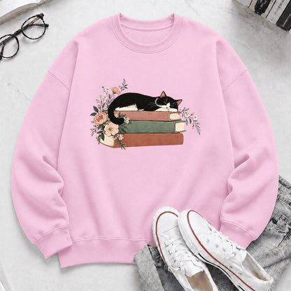 Sleeping Tuxedo Cat On Books Crewneck Sweatshirt | Cat Lover Reader Gift Light Pink