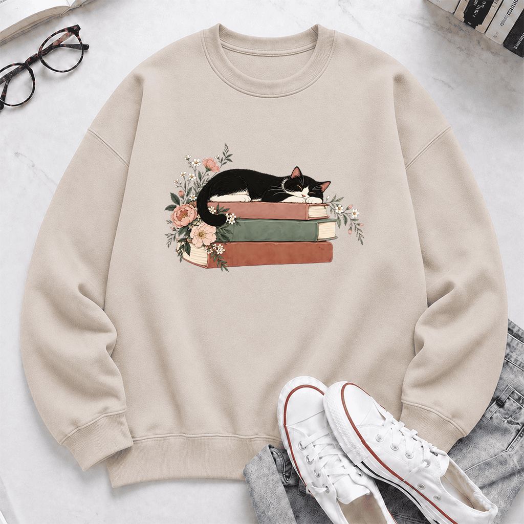 Sleeping Tuxedo Cat On Books Crewneck Sweatshirt | Cat Lover Reader Gift Sand