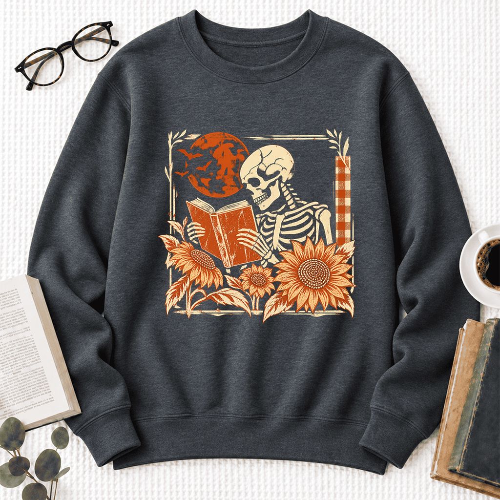 Skeleton Reading Sunflowers Softstyle Sweatshirt | Halloween Book Lover Gift Dark Heather