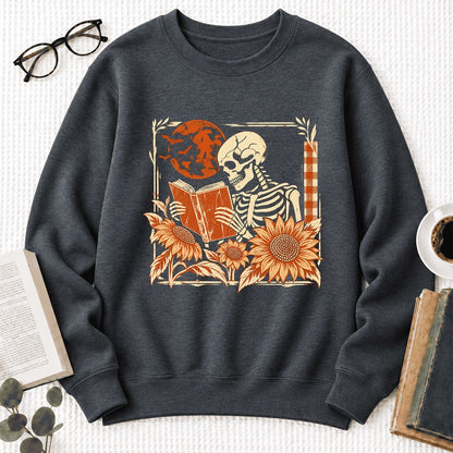 Skeleton Reading Sunflowers Softstyle Sweatshirt | Halloween Book Lover Gift Dark Heather