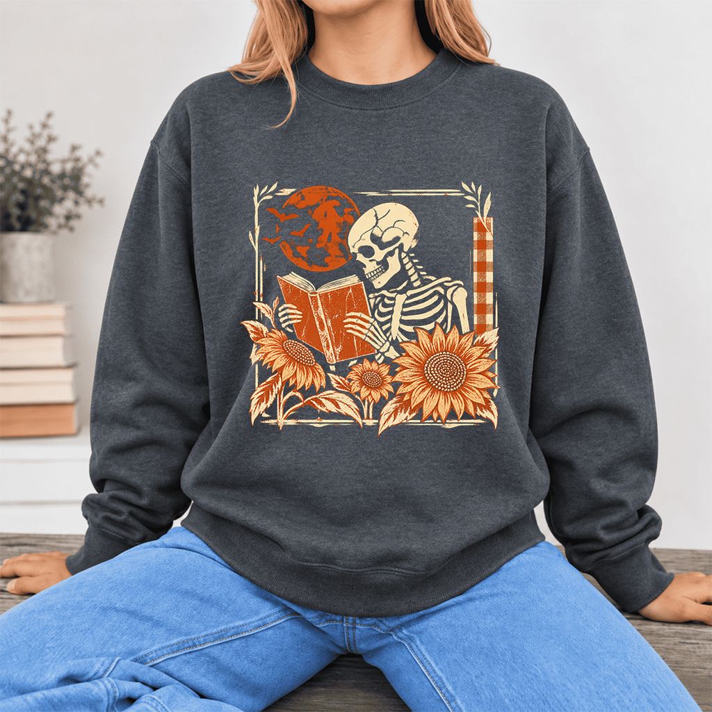 Skeleton Reading Sunflowers Softstyle Sweatshirt | Halloween Book Lover Gift Dark Heather