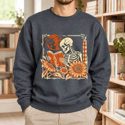 Skeleton Reading Sunflowers Softstyle Sweatshirt | Halloween Book Lover Gift Dark Heather