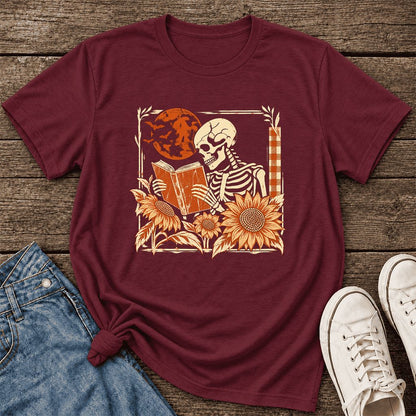 Skeleton Reading Sunflowers Ultra-Soft Cotton T-Shirt | Halloween Reader Gift Maroon