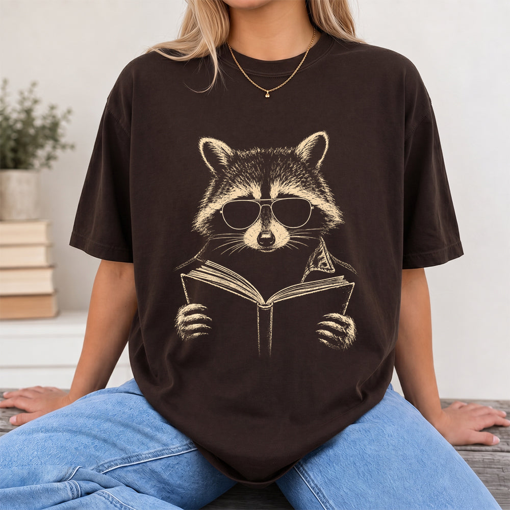 Raccoon Reading Book Softstyle T-Shirt | Book Lover Gift Dark Chocolate