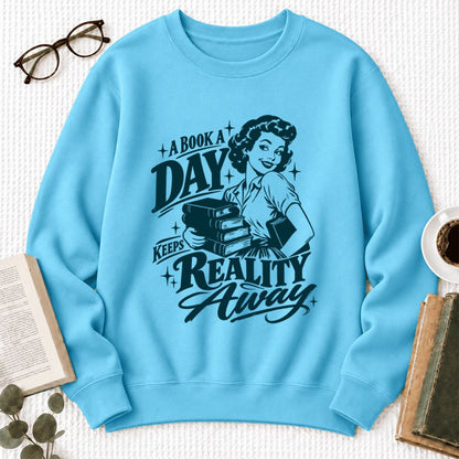A Book A Day Keeps Reality Away Softstyle Sweatshirt | Cozy Book Lover Gift Sky