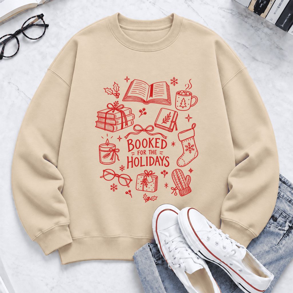 Booked For The Holidays Softstyle Sweatshirt | Christmas Book Lover Gift Sand