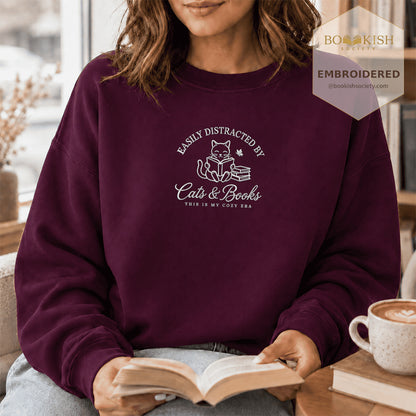 Easily Distracted By Cats And Books V2 Embroidered Sweatshirt | Reader Gift Maroon