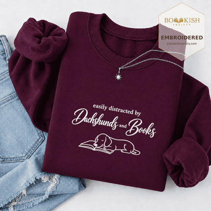 Easily Distracted By Dachshunds And Books Embroidered Sweatshirt | Reader Gift Maroon