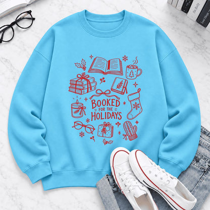 Booked For The Holidays Softstyle Sweatshirt | Christmas Book Lover Gift Sky