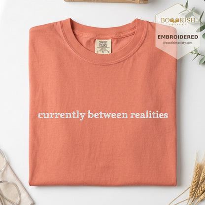 Embroidered Currently Between Realities Comfort Color® T-shirt Book Lover Gift Terracotta