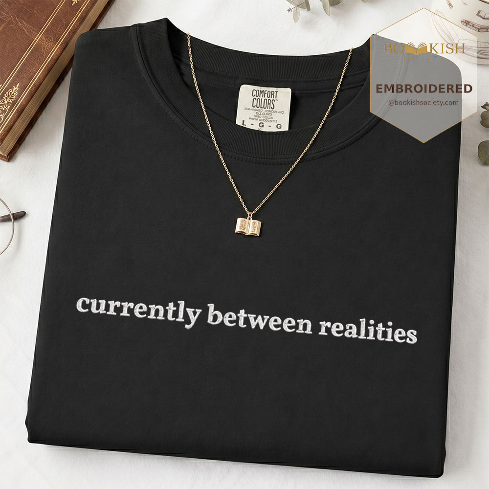 Embroidered Currently Between Realities Comfort Color® T-shirt Book Lover Gift Black