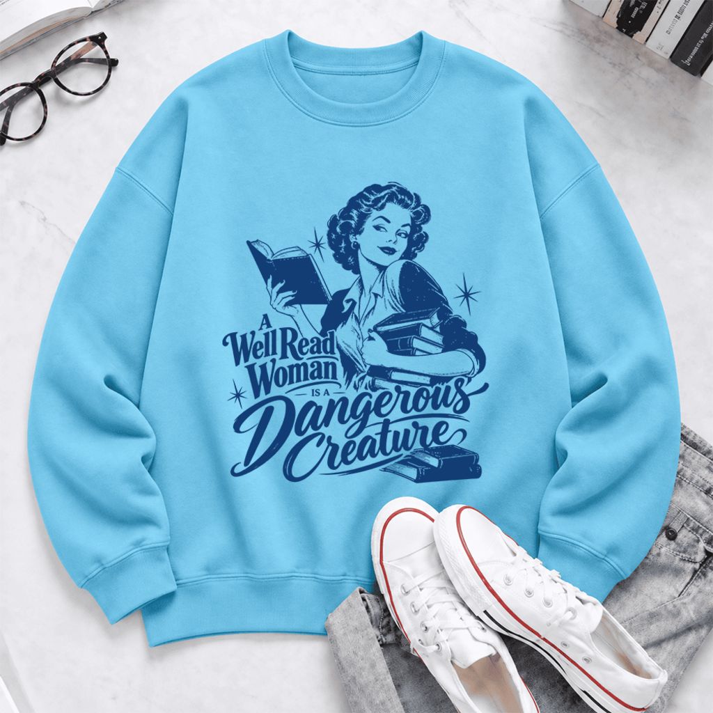 A Well Read Woman Is A Dangerous Creature Softstyle Sweatshirt | Feminist Gift Sky