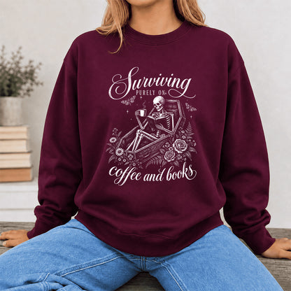 Surviving Purely On Coffee And Books Printed Sweatshirt | Halloween Reader Gift Maroon
