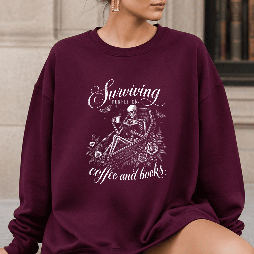 Surviving Purely On Coffee And Books Printed Sweatshirt | Halloween Reader Gift Maroon