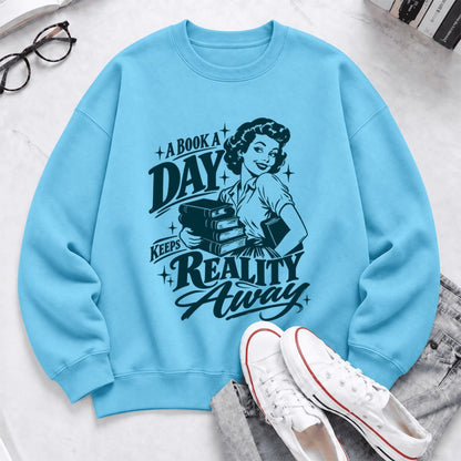 A Book A Day Keeps Reality Away Softstyle Sweatshirt | Cozy Book Lover Gift Sky