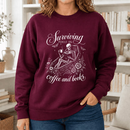 Surviving Purely On Coffee And Books Printed Sweatshirt | Halloween Reader Gift Maroon