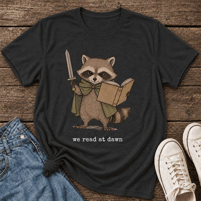 We Read At Dawn Funny Racoon Ultra-Soft Cotton T-Shirt | Playful Reader Gift Black Heather
