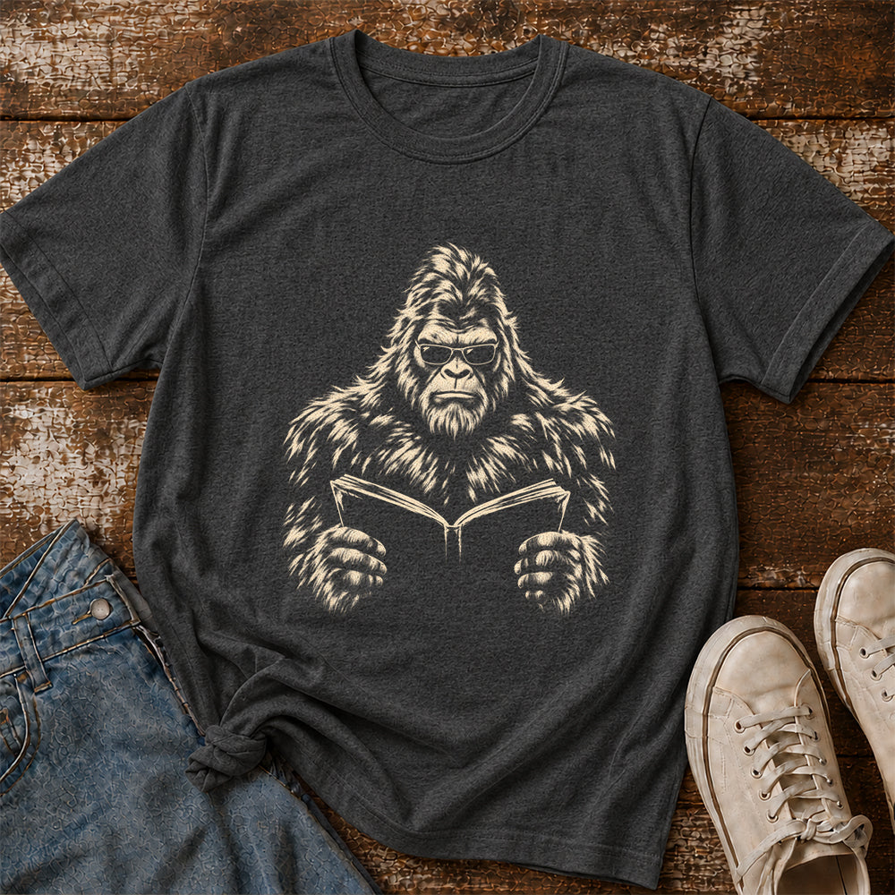 Big Foot Reading Book Softstyle T-Shirt | Book Lover Gift Dark Heather