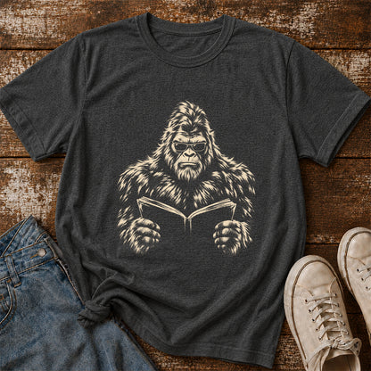 Big Foot Reading Book Softstyle T-Shirt | Book Lover Gift Dark Heather