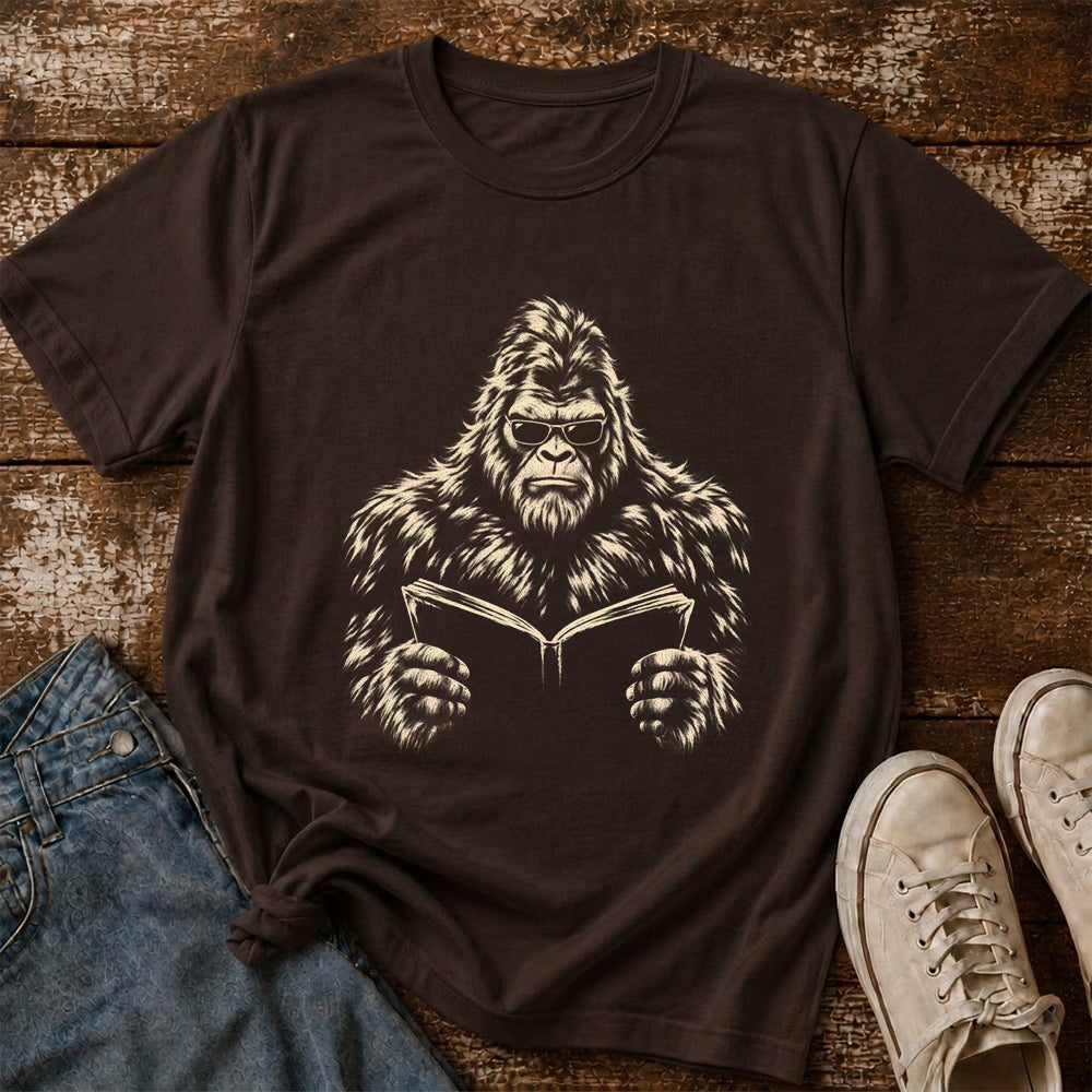 Big Foot Reading Book Softstyle T-Shirt | Book Lover Gift Dark Chocolate