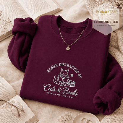 Easily Distracted By Cats And Books V2 Embroidered Sweatshirt | Reader Gift Maroon