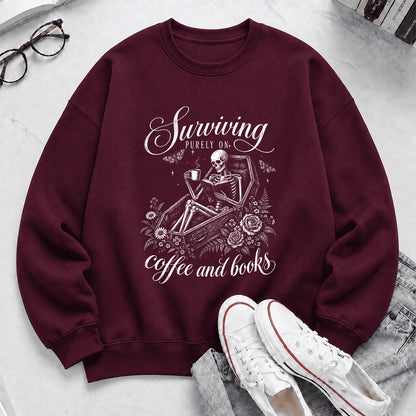 Surviving Purely On Coffee And Books Printed Sweatshirt | Halloween Reader Gift Maroon