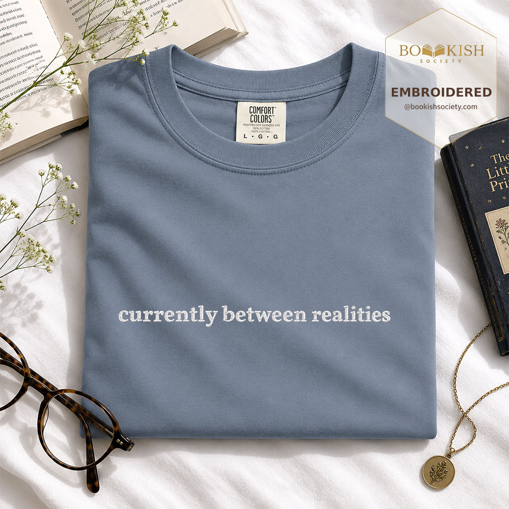 Embroidered Currently Between Realities Comfort Color® T-shirt Book Lover Gift Blue Jean