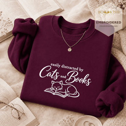 Distracted By Cats And Books Embroidered Sweatshirt | Reader Gift Maroon