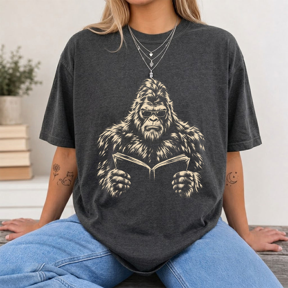Big Foot Reading Book Softstyle T-Shirt | Book Lover Gift Dark Heather