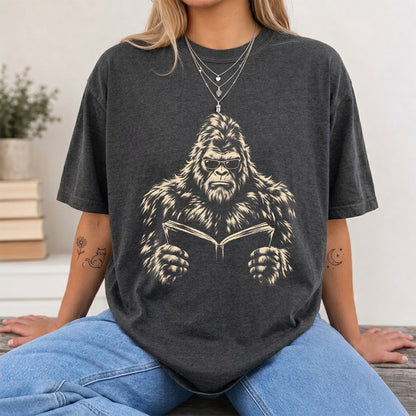 Big Foot Reading Book Softstyle T-Shirt | Book Lover Gift Dark Heather