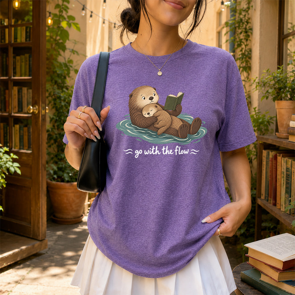 Go With The Flow Otter Reading Softstyle T-Shirt | Book Lover Gift Heather Purple