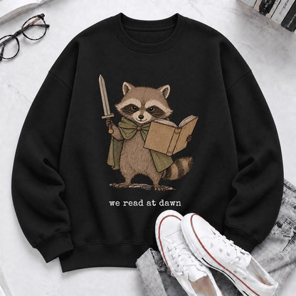 We Read At Dawn Funny Racoon Softstyle Sweatshirt | Cozy Book Lover Gift Black