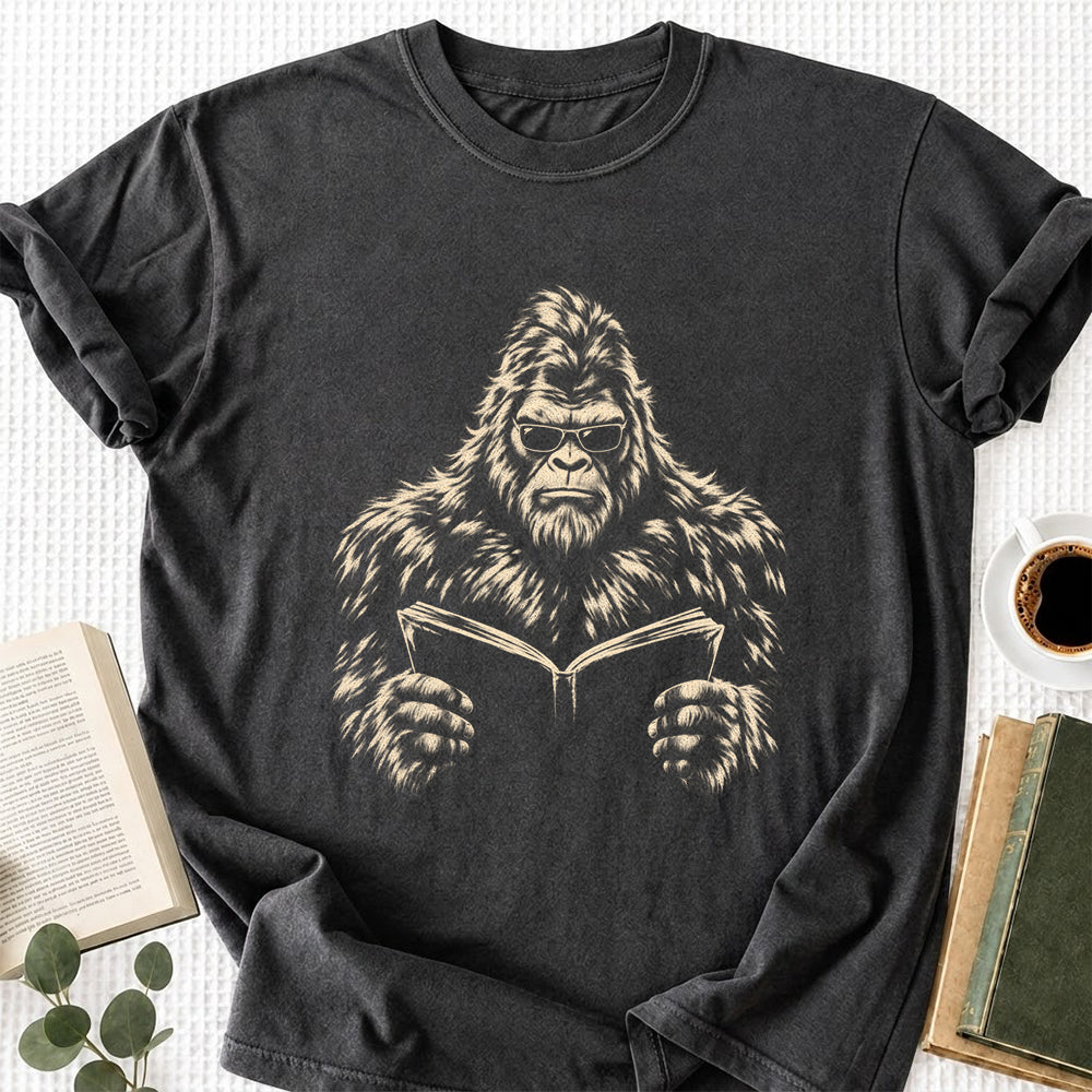 Big Foot Reading Book Softstyle T-Shirt | Book Lover Gift Dark Heather