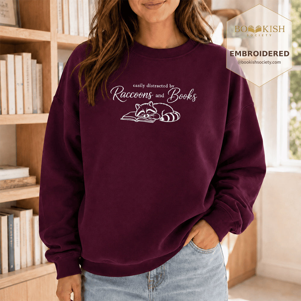 Easily Distracted By Raccoons And Books Embroidered Sweatshirt | Reader Gift Maroon