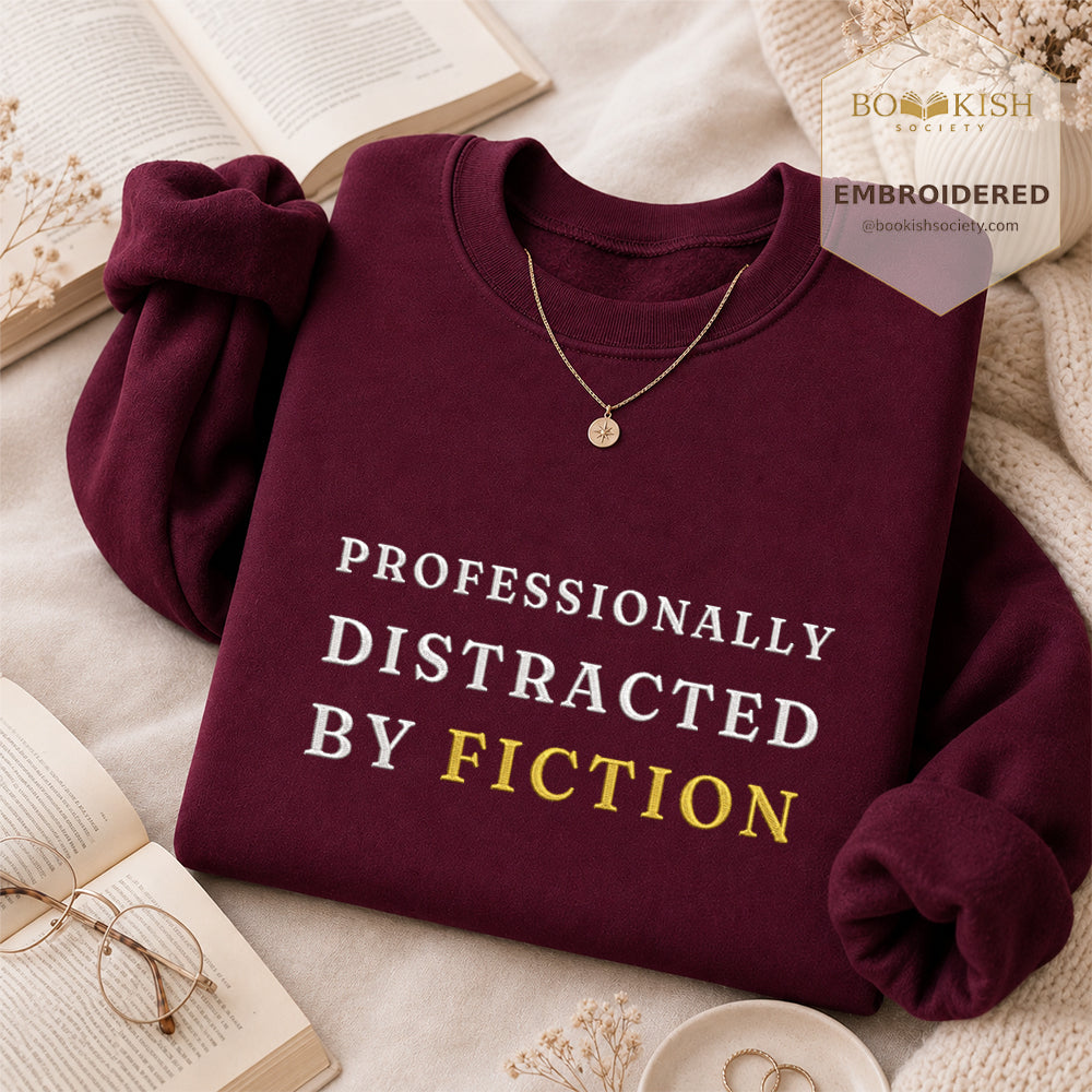 Professionally Distracted By Fiction Embroidered Sweatshirt | Reader Gift Maroon