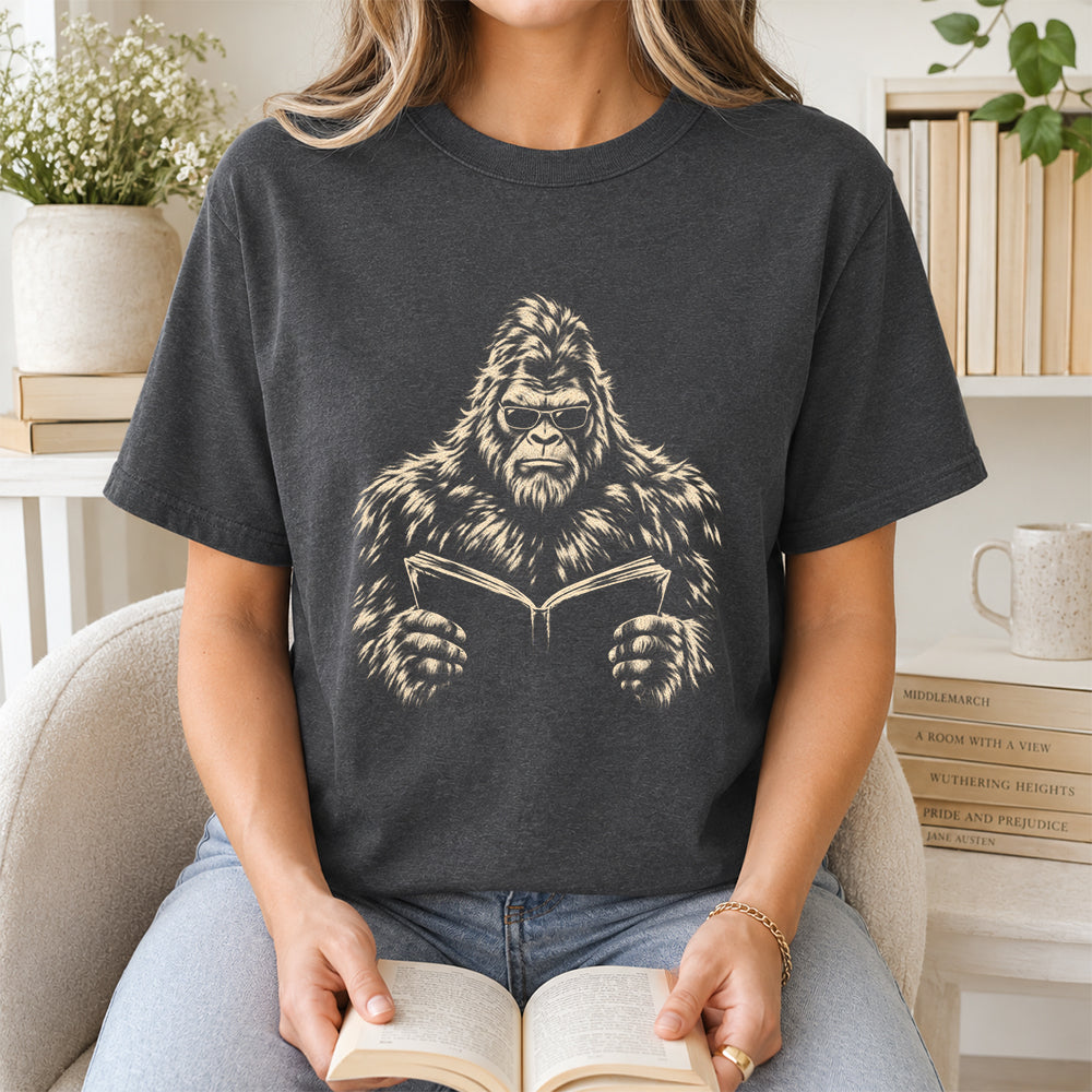 Big Foot Reading Book Softstyle T-Shirt | Book Lover Gift Dark Heather