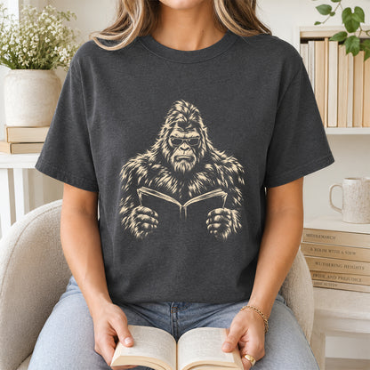 Big Foot Reading Book Softstyle T-Shirt | Book Lover Gift Dark Heather
