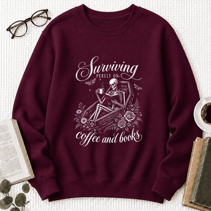 Surviving Purely On Coffee And Books Printed Sweatshirt | Halloween Reader Gift Maroon
