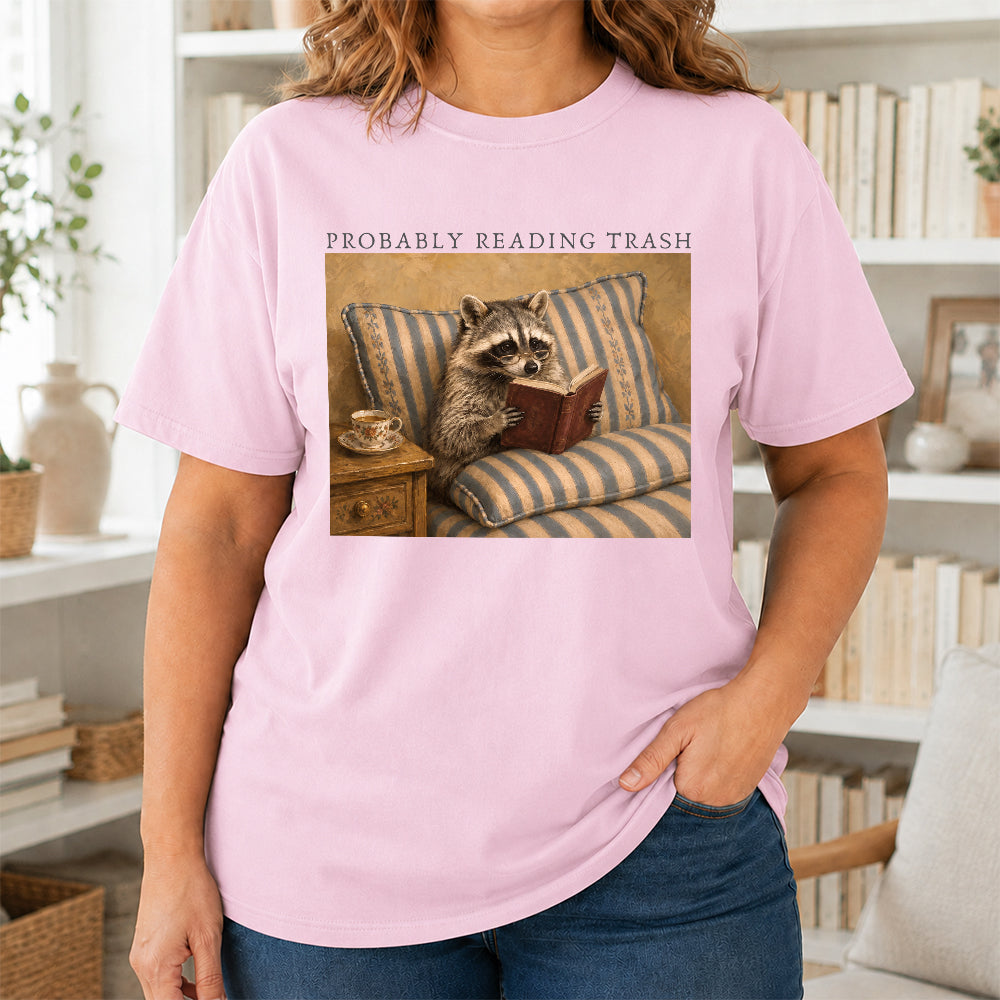 Probably Reading Trash Racoon Softstyle T-Shirt | Book Lover Gift Light Pink