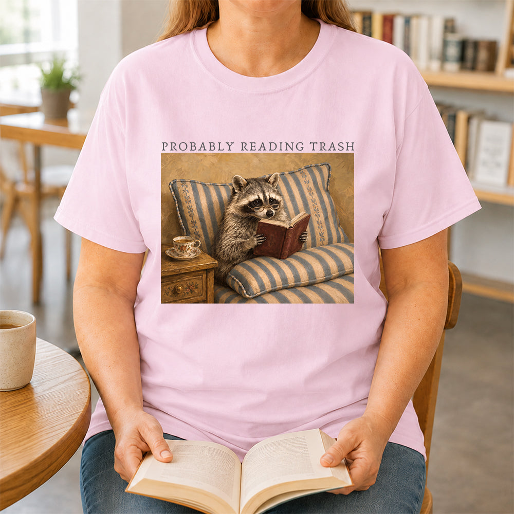 Probably Reading Trash Racoon Softstyle T-Shirt | Book Lover Gift Light Pink