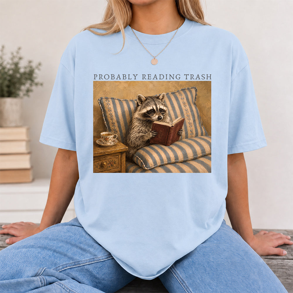 Probably Reading Trash Racoon Softstyle T-Shirt | Book Lover Gift Light Blue